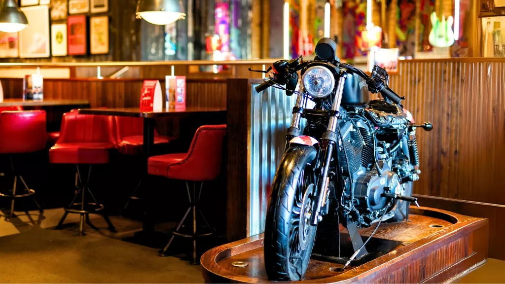 Motorbike and tables inside the restaurant