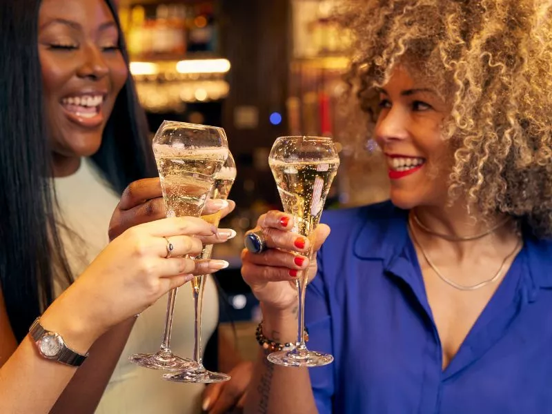 Two women drinking Prosecco