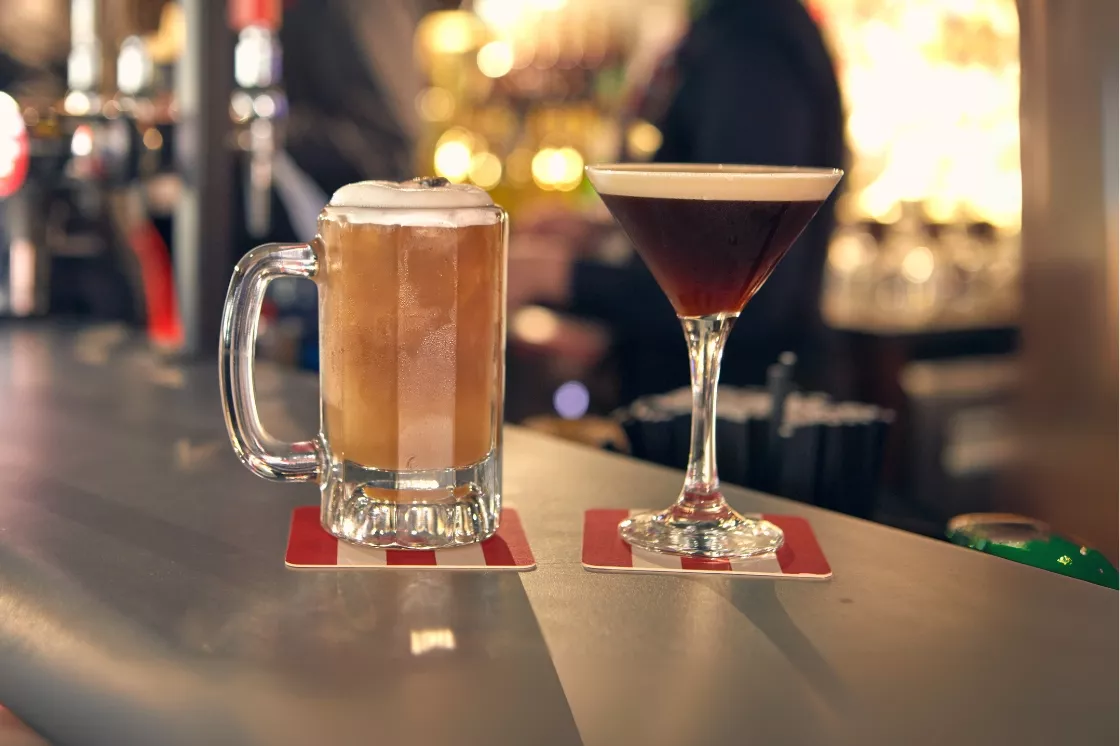 Beer and cocktail on counter