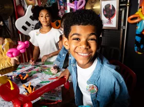 kid smiling at birthday party