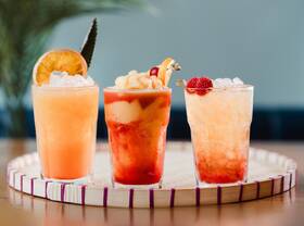 3 colourful cocktails on table 