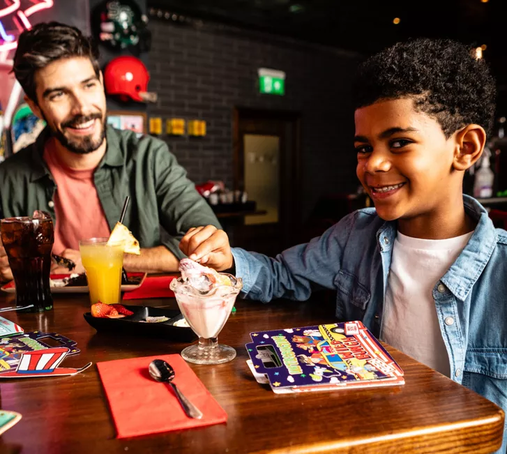 Kid enjoying food at TGIs